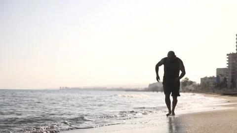 Bald man running on water, sea, feet making splash Stock Footage 238761069