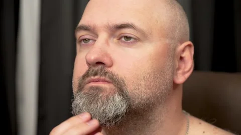 Bald man scratching gray beard. Hairless male itching gray beard Stock Footage 303497434