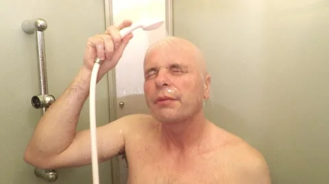 Bald man showering. Video stock 58753953