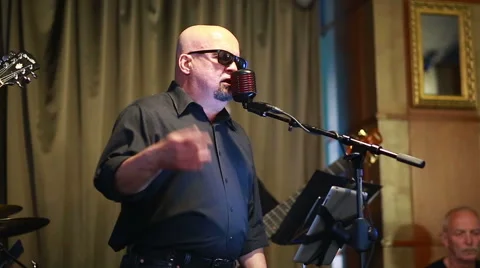 Bald man singer. Restaurant. (Editorial) 스톡 동영상 65499547
