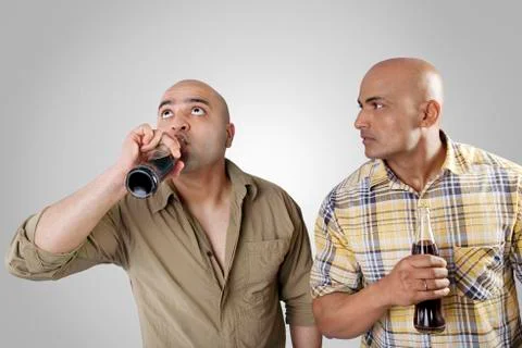 Bald men having a drink Stock Photos