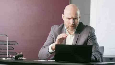 Bald Middle-Aged Businessman Having a Headache Stock Footage 73124190