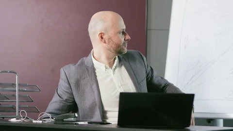 Bald Middle-Aged Businessman Lying on a Chair Stock Footage 73125151