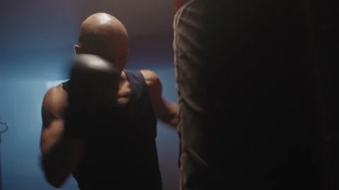 A bald person preparing for a boxing match Stock Footage 258252085