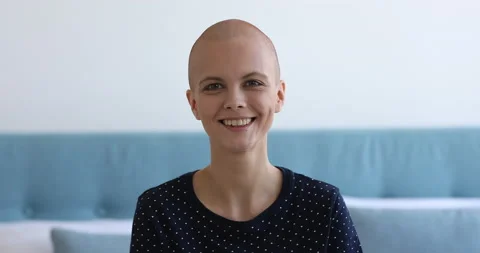 Bald woman cancer patient believes in healing feels hopefulness Stock Footage