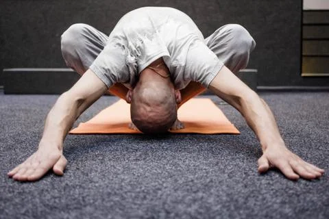 Bald yogi in a bow Stock Photos