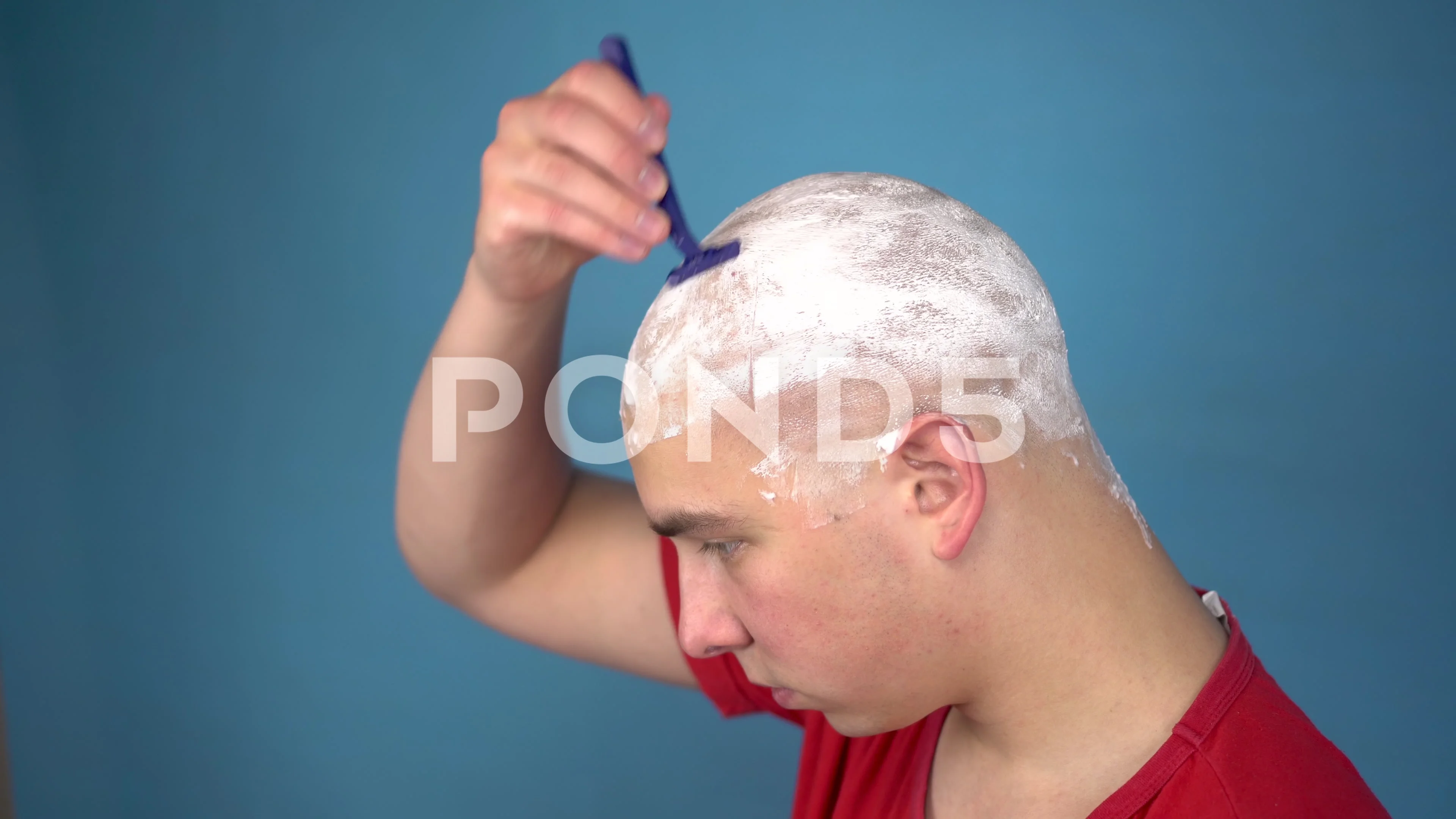 Young man shaved head