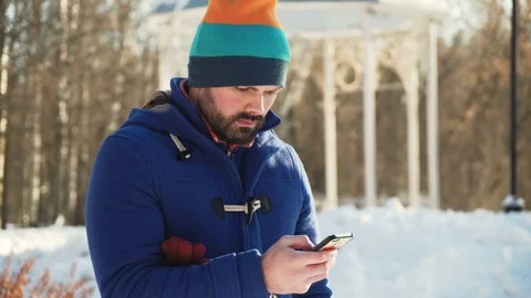 Bald young man portrait in winter park Stock Footage 72279331