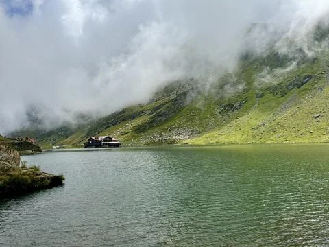 Bâlea Lake Chalet surrounded by dramatic fog in the Carpathian Mountains Stock Photos
