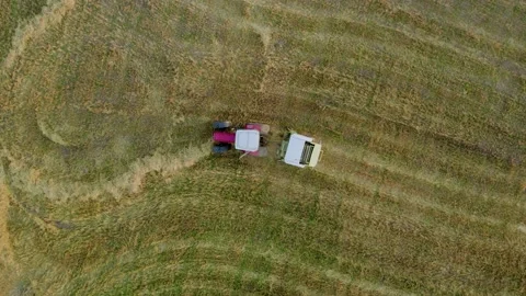 Baler wrapper working on the  field. View from top. Stock Footage 204927014