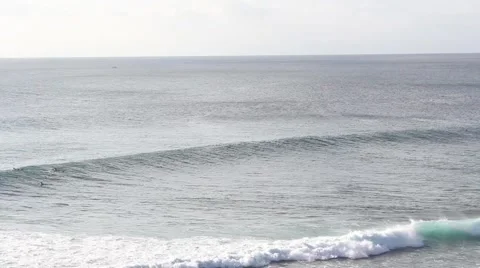 Bali 2 Surfers in/out screen Blue Point Uluwatu Stock Footage 67581928