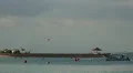 Bali beach with incoming boat and aeroplane HD Footage