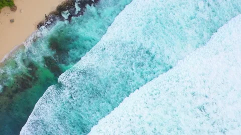 Bali - Big ocean waves hitting a rocky beach. Stock Footage 134622145