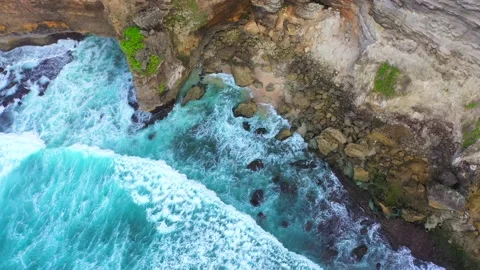 Bali - Big ocean waves hitting a rocky beach. Stock Footage 134680944