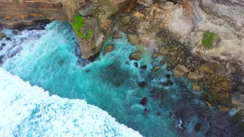 Bali - Big ocean waves hitting a rocky beach. Stock Footage 134680977