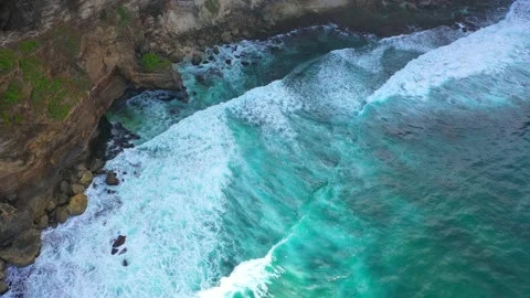 Bali - Big ocean waves hitting a rocky beach. Stock Footage 134681210