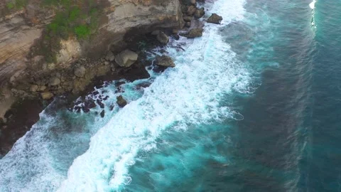 Bali - Big ocean waves hitting a rocky beach. Stock Footage 134681898