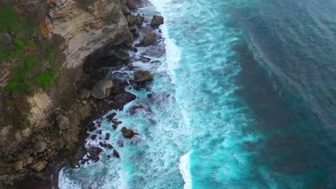 Bali - Big ocean waves hitting a rocky beach. Stock Footage 134681933
