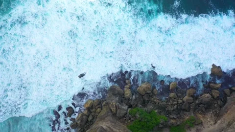 Bali - Big ocean waves hitting a rocky beach. Stock Footage 134682213