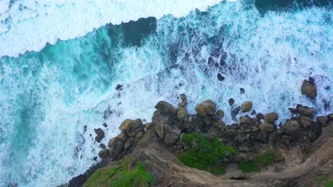 Bali - Big ocean waves hitting a rocky beach. Stock Footage 134682244