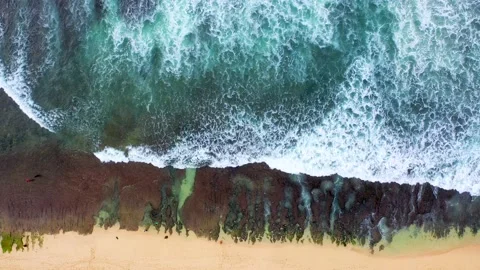 Bali - Big ocean waves hitting a rocky beach. Stock Footage 134682975