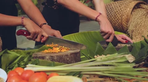Bali cooking class close up, two women chopping and grinding Stock Footage 68061181