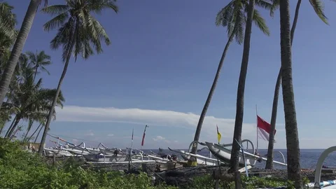 BALI, INDONESIA OCTOBER 2016: Tradichionny boats of fishermen on seashore and Stock Footage