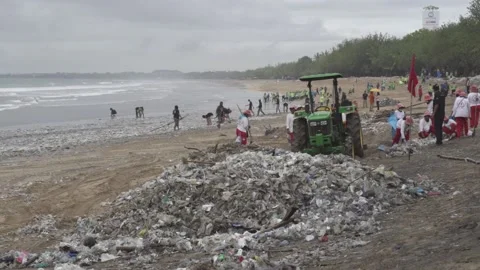 Bali Indonesia Tons of Trash, Garbage, Plastic Waste Cleanup Kuta Beach Stock Footage 146000298