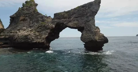 Bali Rock Arch Drone Fly Through Stock Footage 106787105