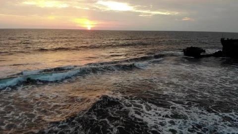 Bali Temple at Beach with Waves During Sunset in Slow Motion, Aerial View Stock Footage 142312067