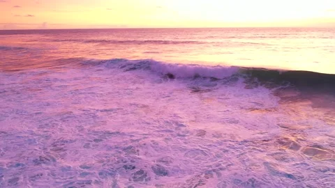 Bali - waves hitting coral reef and rocky cliffs. Sunset over the ocean. Stock Footage 134620120