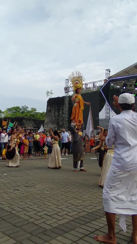 A Balinese dancer in an orange costume performs  - 0216 (2)(24) Stock Footage 302236357