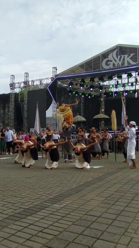 A Balinese dancer in an orange costume performs atop - 0216 (2)(25) Stock Footage 302236358