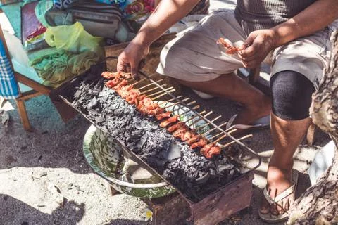 Balinese indonesian street food chicken sate. Preparing chicken sate. Bali Stock Photos
