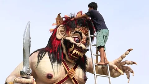 Balinese man makes figure Ogoh-ogoh for religious ritual. Ubud, Bali, Indonesia Stock Footage