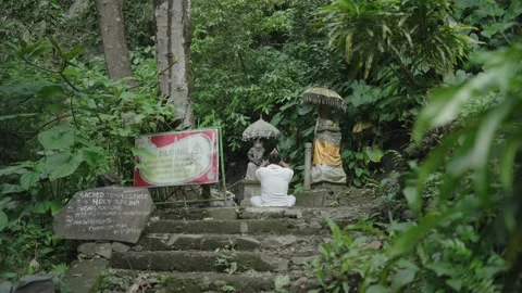 Balinese Man Praying on The Temple Surrounded by Green Forest Bali, Indonesia Stock Footage 221648686