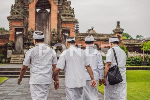 Balinese people in traditional clothes during religious ceremony at Pura Taman Stock Photos