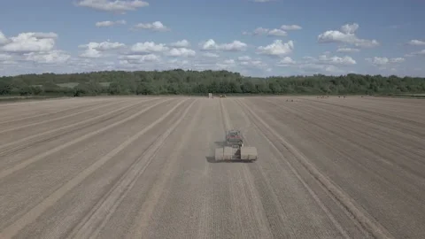 Baling machine in wheat field, Derbyshire, England Stock Footage 205931253