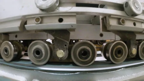 Ball Baring Wheels Rolling Paper Across Industrial Machine Stock Footage 159018203