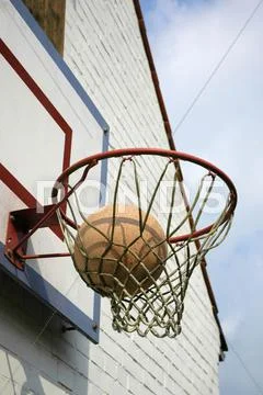 Ball In Basketball Basket