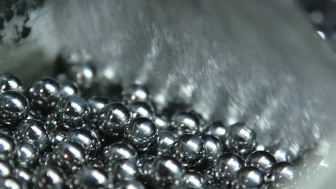 Ball bearings being washed close up Stock Footage 311088786