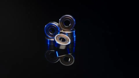 Ball Bearings With Blue Seals, Reflective Studio Surface, Macro Product Shot Video stock 341509810