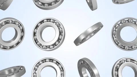 Ball Bearings Falling on a Light Blue Background. Steel Textured Ball Bearings. Stock Footage 306213701