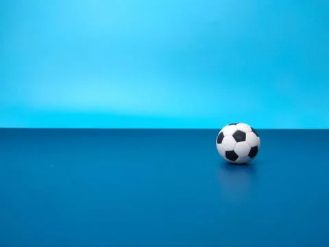 A ball is on a blue background Stock Photos