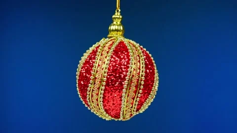 Ball on blue background. Silver New Year's toy rotates around its axis, macro ph Stock Footage 227718338