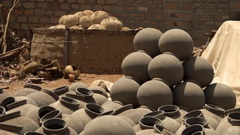 A ball of clay placed on a wheel Stock Footage 99915567