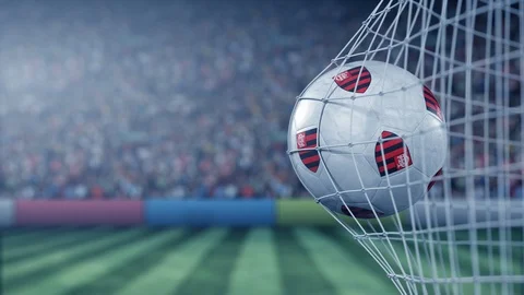 Ball with Clube De Regatas Do Flamengo football club logo hits football goal net Stock Footage 118021006