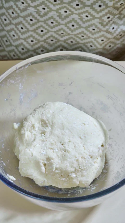 Ball of cookie dough with cottage cheese, eggs, butter and flour. Stock Footage 299632692