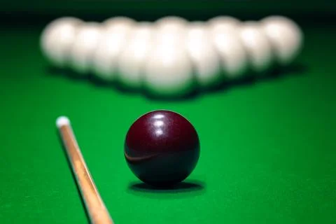 Ball is displayed on the pool table against the background of other balls a.. Stock Photos