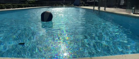 Ball Floating in a swimming pool Stock Footage 163941179